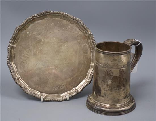 A silver mug, Sheffield 1938, maker Roberts & Belk and a silver presentation waiter, Birmingham 1935, approx. 27 oz.